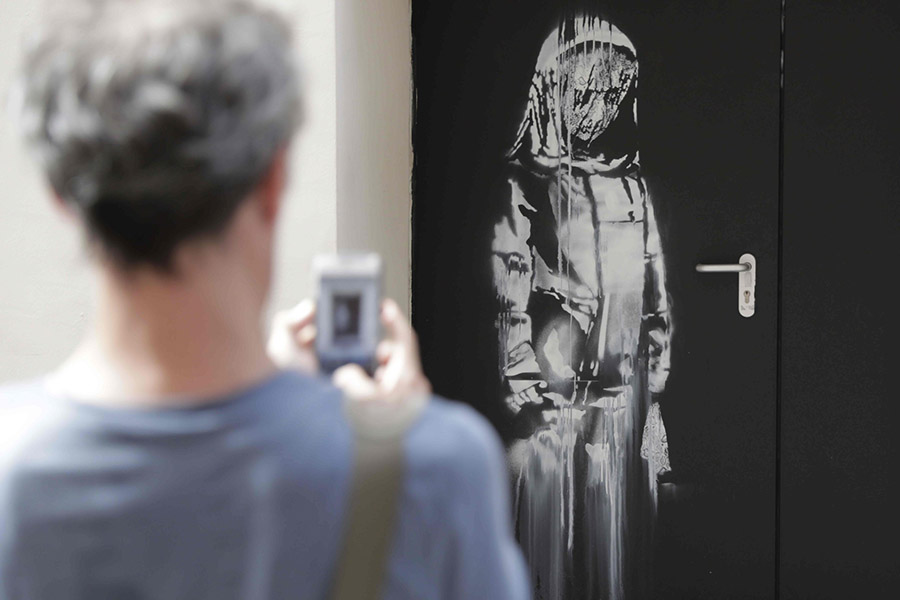 The Bataclan Banksy Vanishes After Being Stolen by Two Masked Men